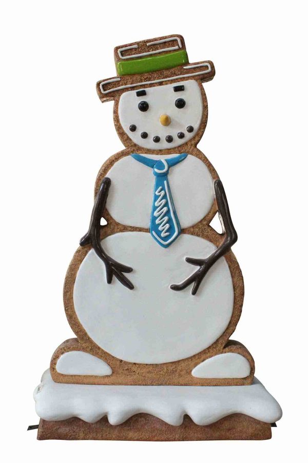 Iced gingerbread looking snowman wearing a blue tie with green hat